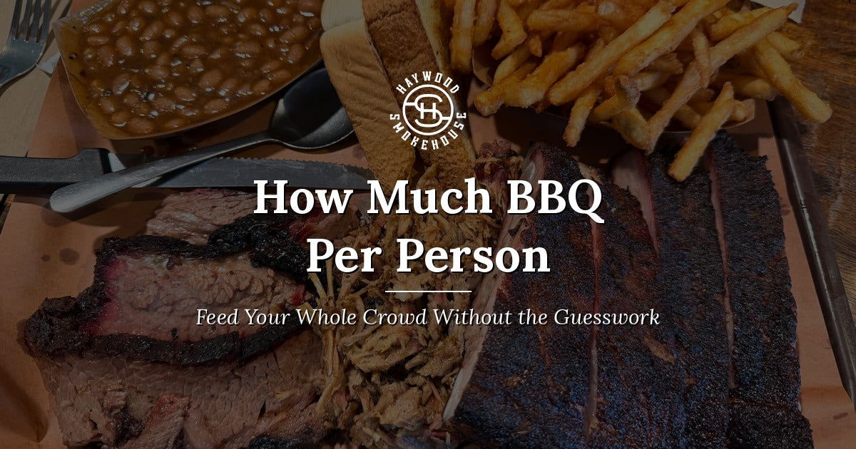 Haywood Smokehouse tray of slow-smoked sliced brisket, chopped pork, and St. Louis style ribs with baked beans, fries, and Texas Toast.