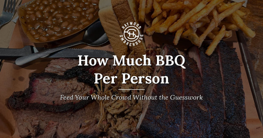 Haywood Smokehouse tray of slow-smoked sliced brisket, chopped pork, and St. Louis style ribs with baked beans, fries, and Texas Toast.